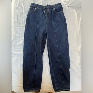 Toteme blue high waist tapered jeans with front hem detail